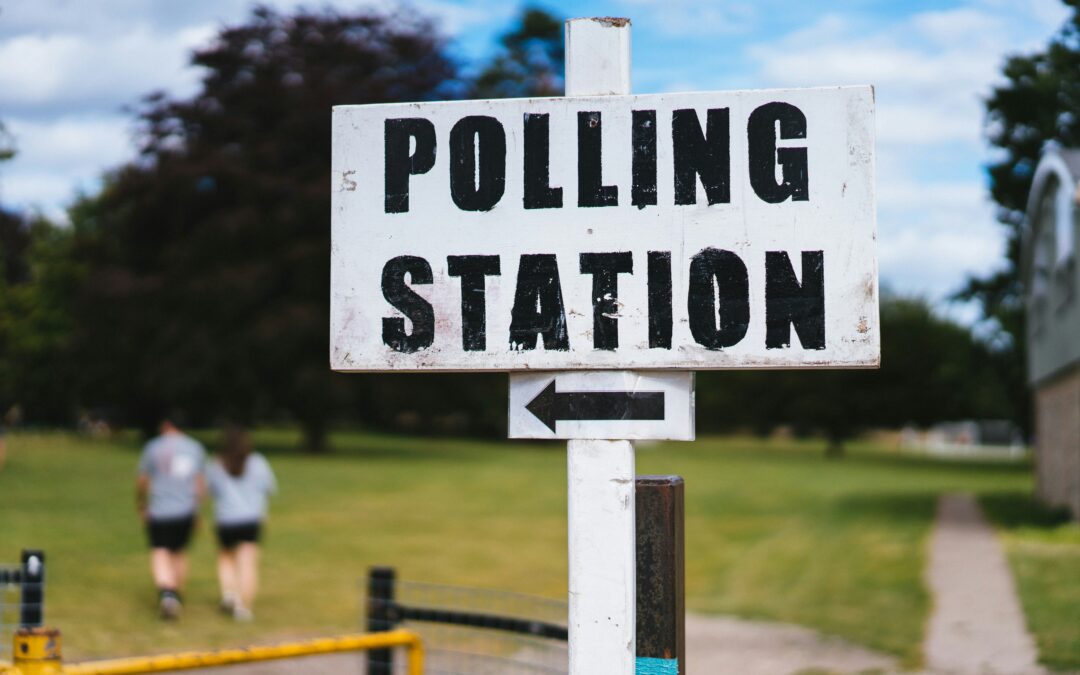 Polling Station sign with arrow pointing to the left