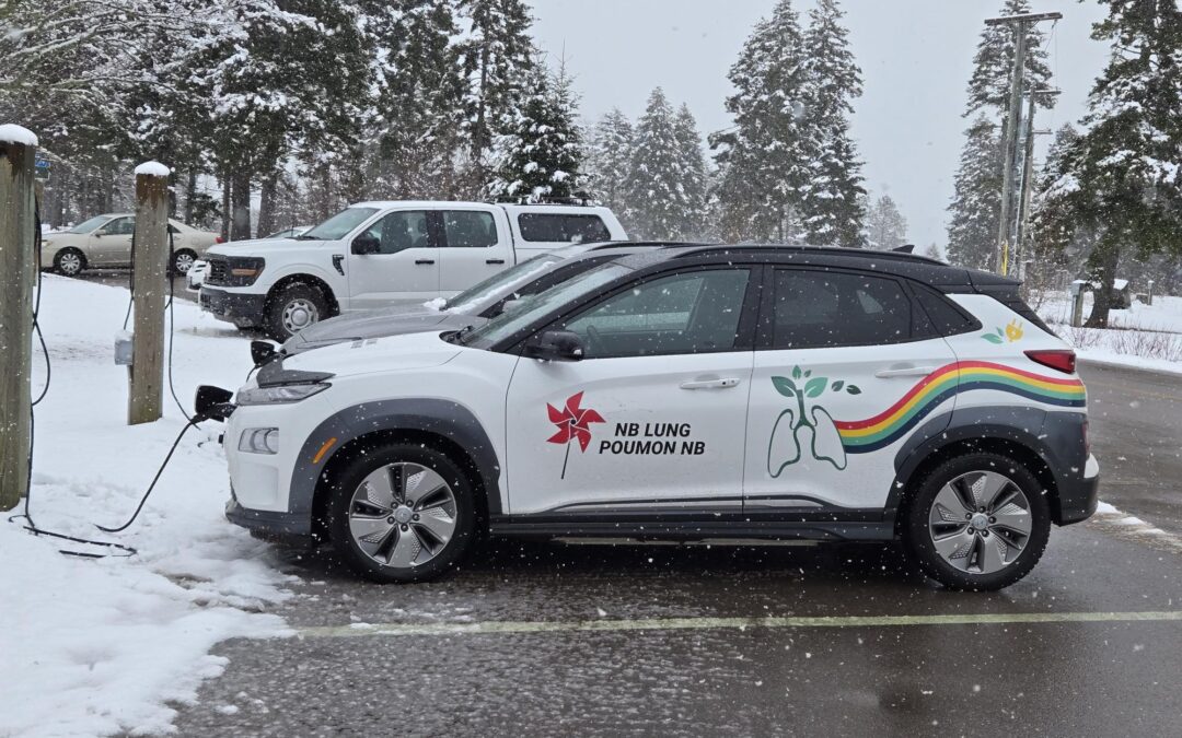 NB Lung Wrapped/Branded EV - Kona, parked, charging in the winter